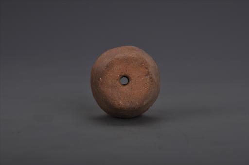 商斜边泥质红褐陶纺轮