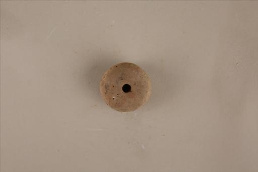 新石器时代大溪文化算珠形中穿夹细砂红褐陶纺轮