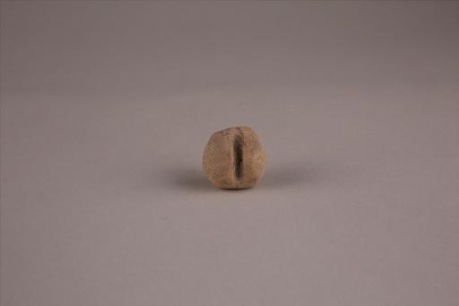 商圆形凹槽夹细砂黄褐陶网坠