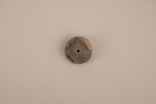 新石器时代大溪文化圆饼形中穿黑彩十字形弦纹夹细砂黄褐陶纺轮