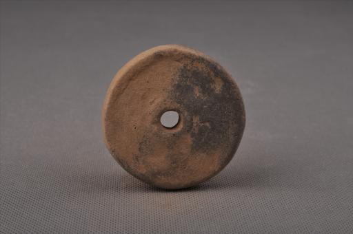 新石器时代大溪文化圆饼形中穿夹砂灰褐陶纺轮