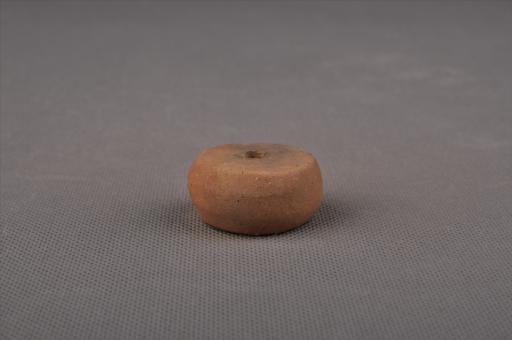 新石器时代大溪文化算珠形中穿夹砂红褐陶纺轮