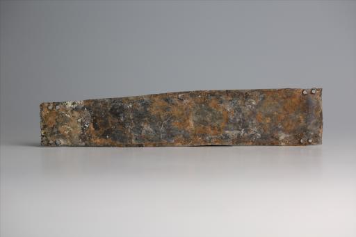 春秋时期长梯形勾连蟠虺纹锡饰片