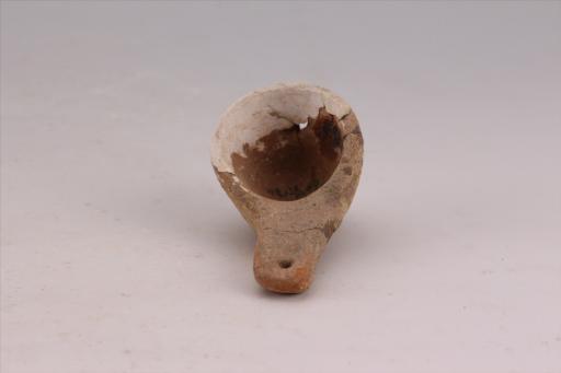 新石器时代城背溪文化圆形穿孔扁柄夹砂褐陶勺