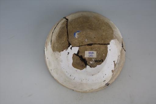 东汉侈口凹沿斜弧腹平底泥质黄陶钵