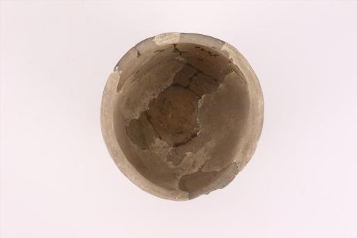 商敛口鼓腹平底夹砂红褐陶罐