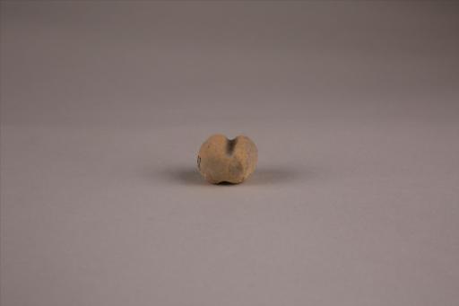 商圆形凹槽夹细砂黄褐陶网坠