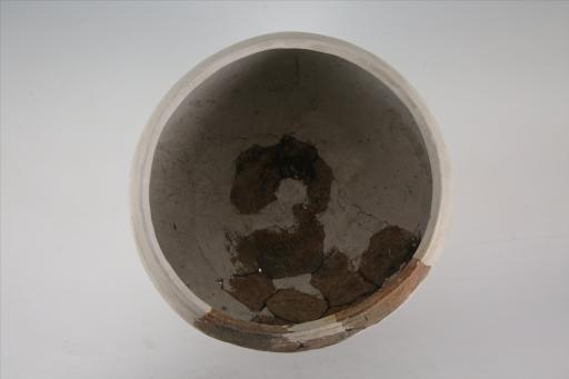 商敛口方唇弧肩平底戳印纹夹砂红褐陶罐