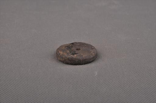 新石器时代屈家岭文化圆饼形中穿夹砂褐陶纺轮