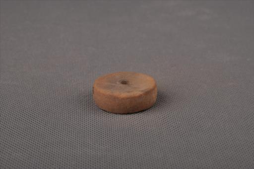 新石器时代屈家岭文化圆饼形中穿夹砂黄褐陶纺轮