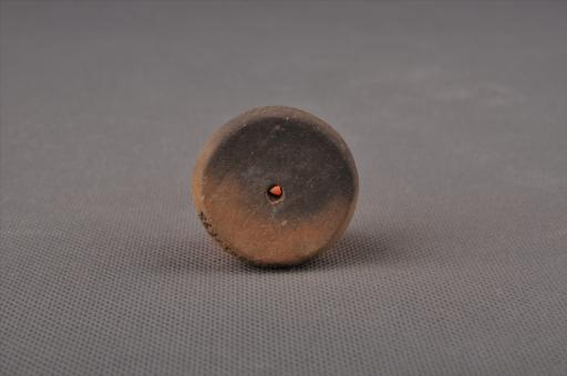 新石器时代大溪文化圆饼形中穿夹砂黄褐陶纺轮