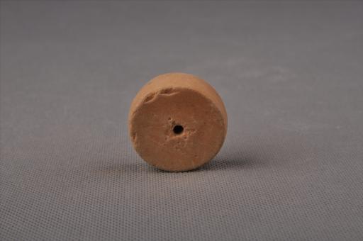 新石器时代大溪文化扁圆柱形中穿夹砂黄褐陶纺轮
