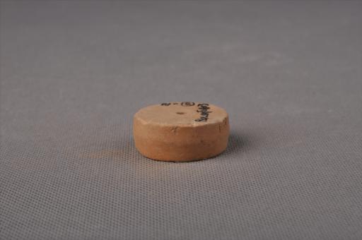 新石器时代大溪文化扁圆柱形中穿夹砂黄褐陶纺轮
