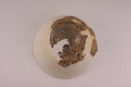 新石器时代城背溪文化侈口弧腹平底绳纹夹砂黑褐陶碗
