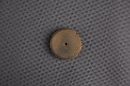 新石器时代屈家岭文化圆饼形中穿夹砂黄褐陶纺轮
