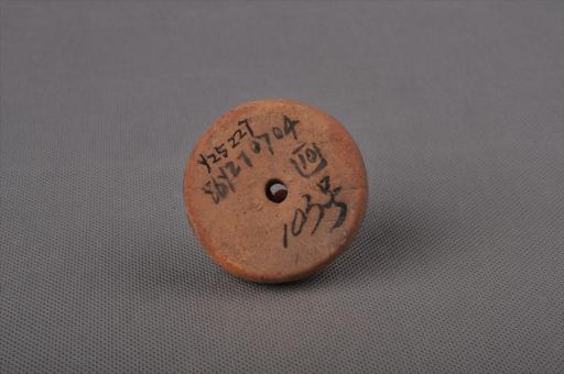 新石器时代大溪文化圆饼形圆点网格纹泥质红陶纺轮