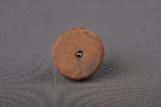 新石器时代大溪文化圆饼形圆点网格纹泥质红陶纺轮