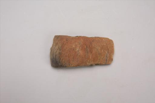 新石器时代大溪文化弧顶斜弧刃灰白色石锛