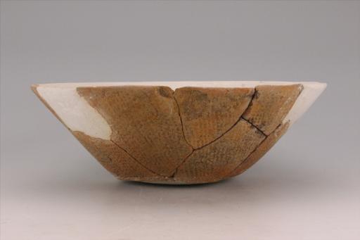 新石器时代城背溪文化敞口斜腹平底绳纹夹砂红陶碗