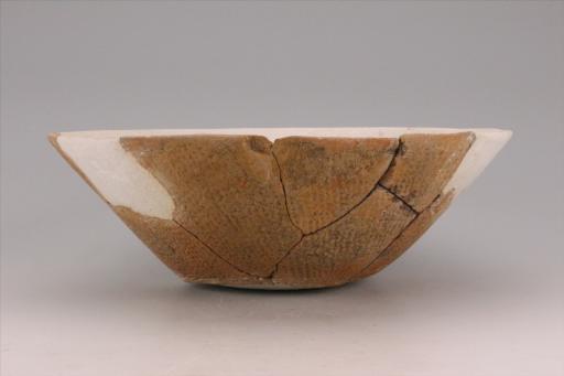 新石器时代城背溪文化敞口斜腹平底绳纹夹砂红陶碗