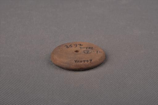 新石器时代屈家岭文化圆饼形中穿夹砂黄褐陶纺轮