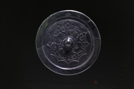 东汉球钮柿蒂连弧纹夔纹铜镜