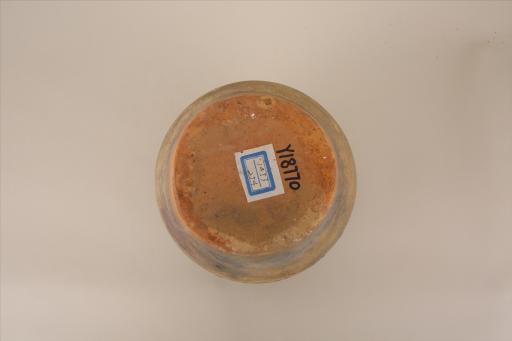 明敛口圆唇深弧腹平底双耳凹弦纹酱黄釉瓷罐